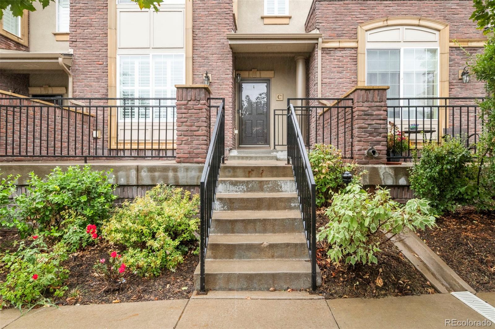 592 Brookhurst Avenue, Unit 26C Highlands Ranch, CO 80129 - Photo 2 of 30 a view of a house with potted plants