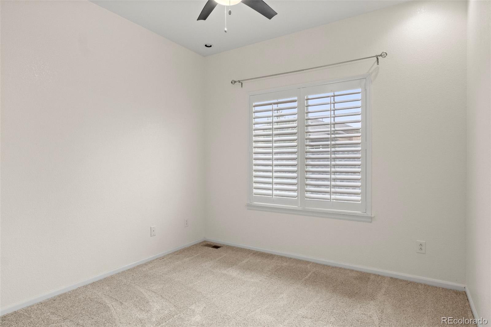 592 Brookhurst Avenue, Unit 26C Highlands Ranch, CO 80129 - Photo 29 of 30 an empty room with a window
