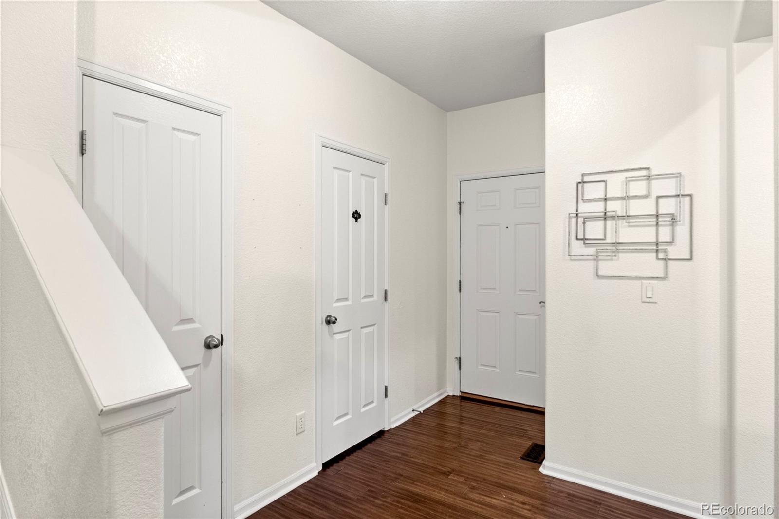 592 Brookhurst Avenue, Unit 26C Highlands Ranch, CO 80129 - Photo 3 of 30 a view of entryway with wooden floor