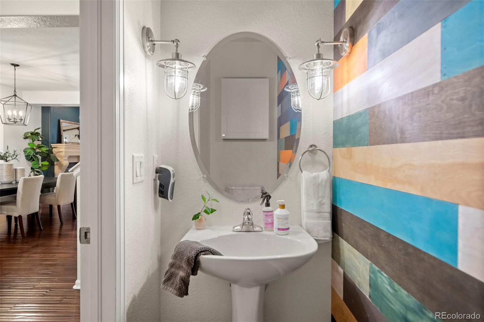 592 Brookhurst Avenue, Unit 26C Highlands Ranch, CO 80129 - Photo 4 of 30 a bathroom with a sink a mirror and vanity
