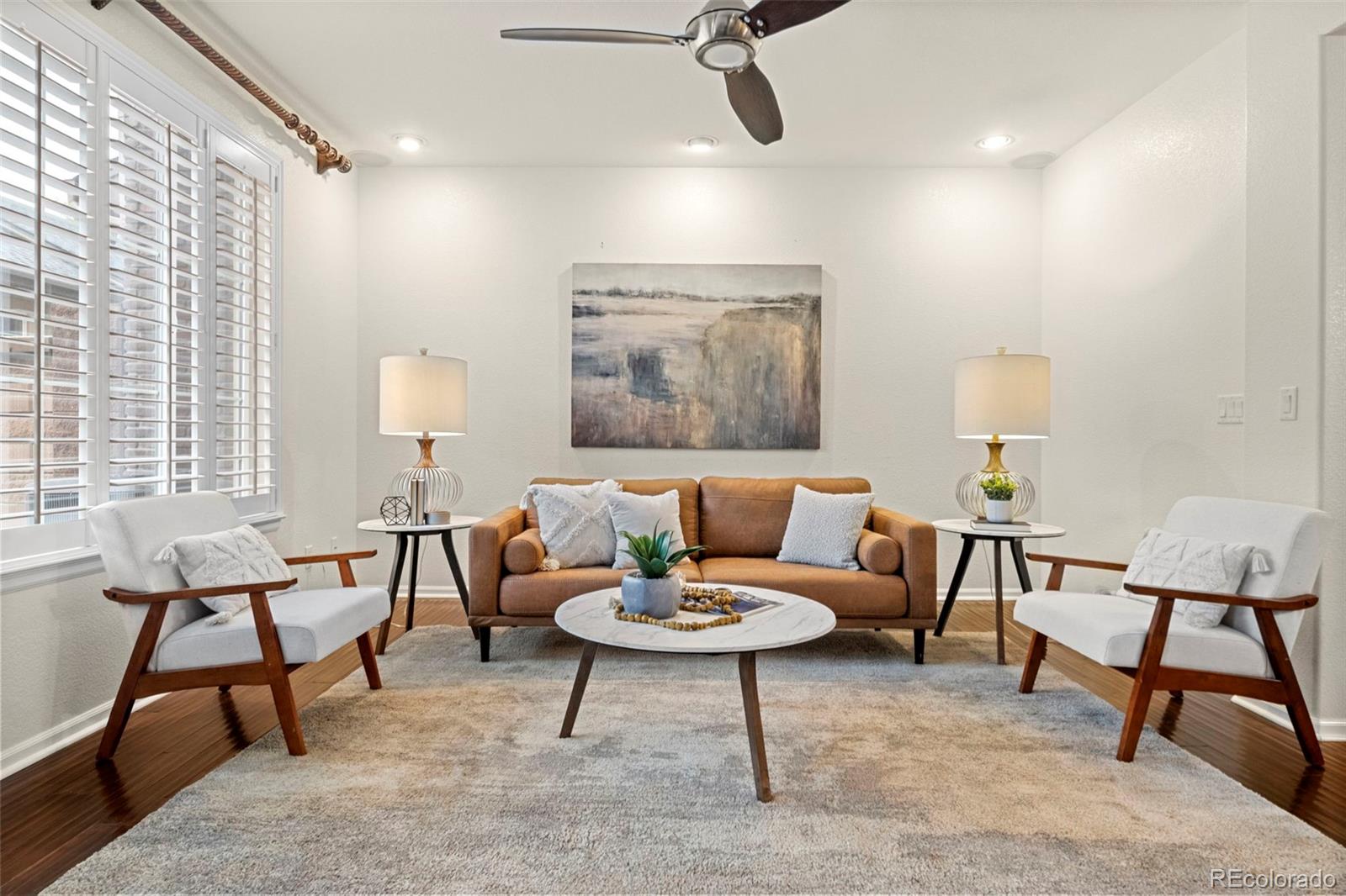 592 Brookhurst Avenue, Unit 26C Highlands Ranch, CO 80129 - Photo 10 of 30 a living room with furniture and a potted plant