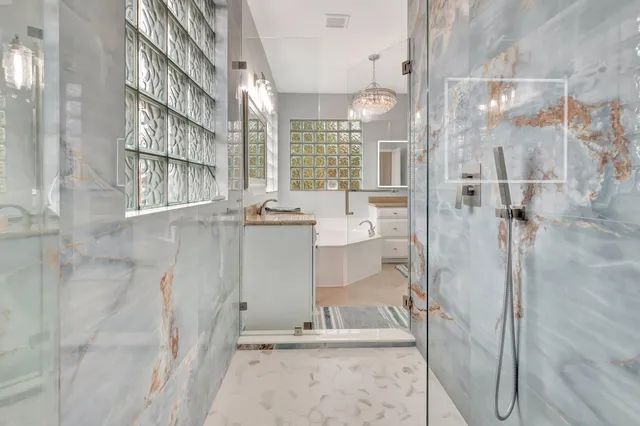 an empty room with a window and a ceiling fan