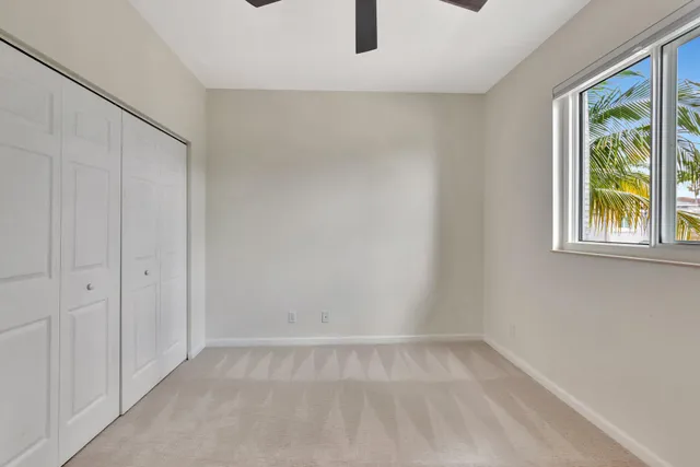 a bathroom with a double vanity sink toilet mirror and shower