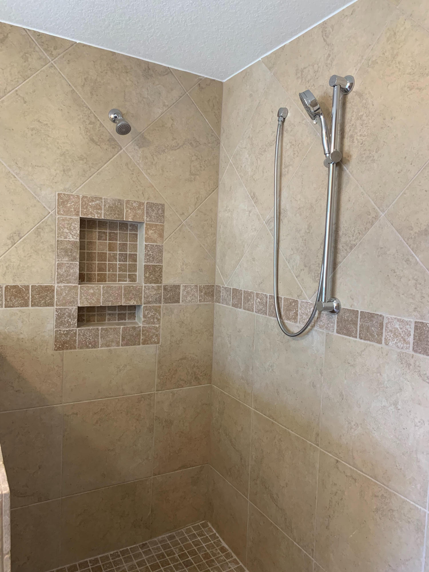 8716 El Paseo Street Navarre, FL 32566 - Photo 2 of 3 a bathroom with a glass shower door