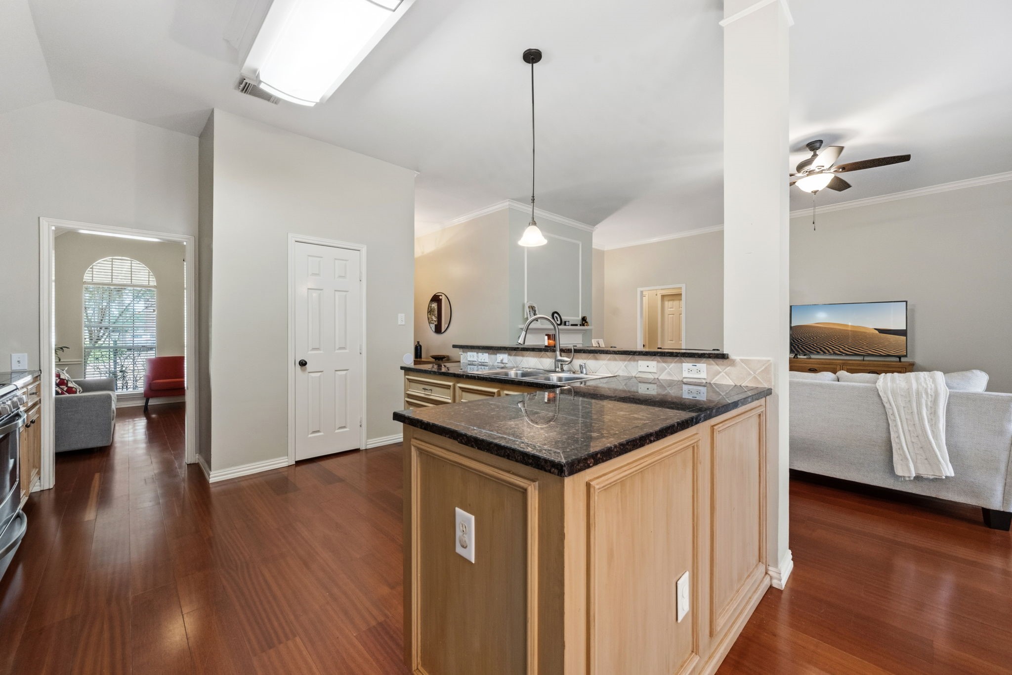 7514 Tumbling Road Humble, TX 77346 - Photo 12 of 28 a kitchen with a sink a counter space and wooden floor