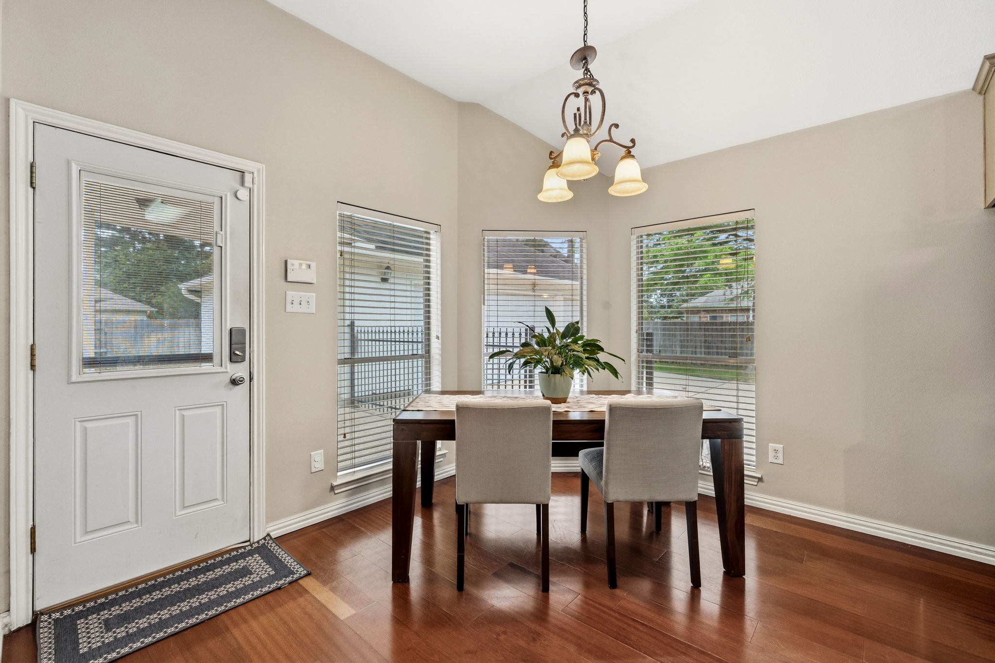 7514 Tumbling Road Humble, TX 77346 - Photo 14 of 28 a view of a dining room with furniture window and wooden floor