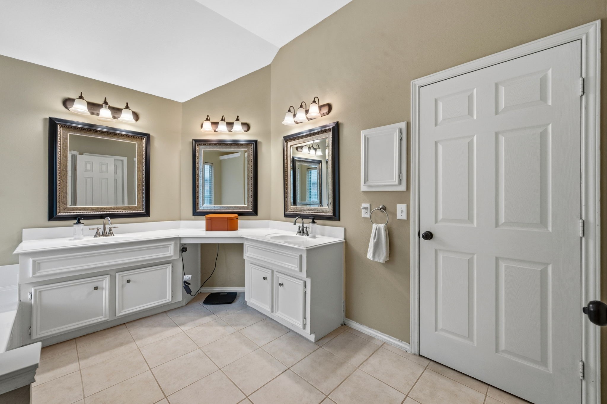 7514 Tumbling Road Humble, TX 77346 - Photo 17 of 28 a spacious bathroom with a double vanity sink and a mirror