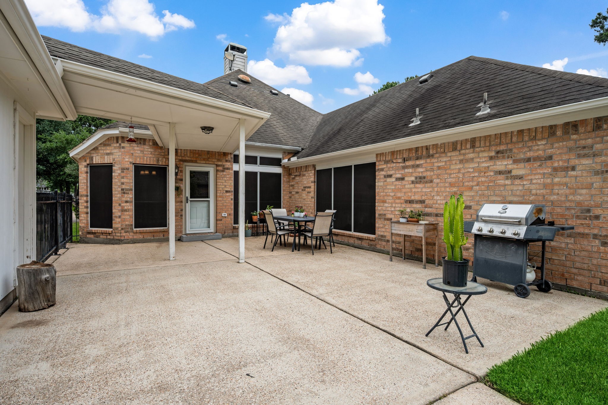 7514 Tumbling Road Humble, TX 77346 - Photo 23 of 28 a view of a patio with table and chairs and potted plants