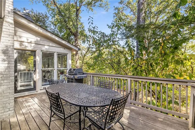 a view of balcony with furniture and wooden deck