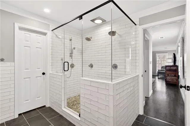 a bathroom with a shower and a sink