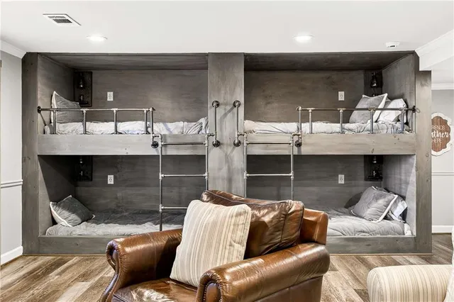 a living room with stainless steel appliances kitchen island granite countertop furniture and a fireplace