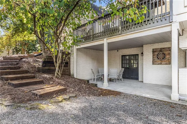 a view of a house with a yard and tree s