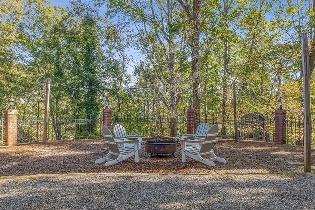 a backyard of a house with barbeque oven