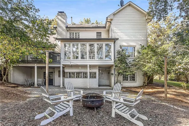 a front view of a house with parking space