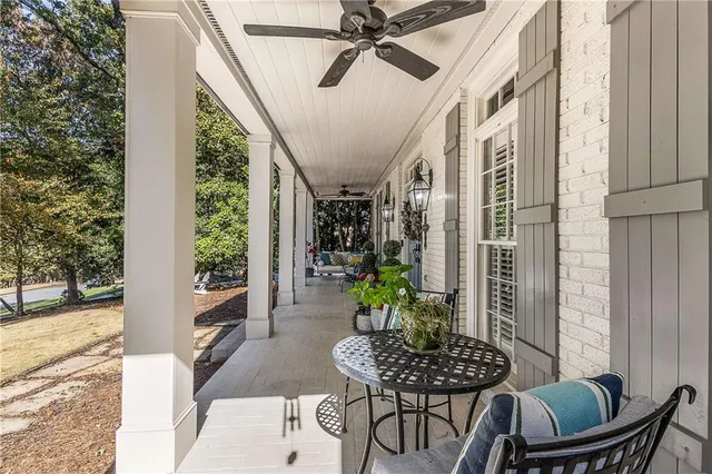 a view of a patio with couches and potted plants