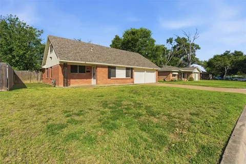 a house view with a garden space