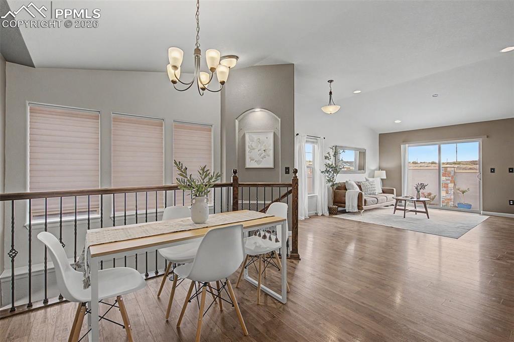 4467 Hessite Loop Colorado Springs, CO 80938 - Photo 11 of 37 a view of a dining room with furniture window and wooden floor
