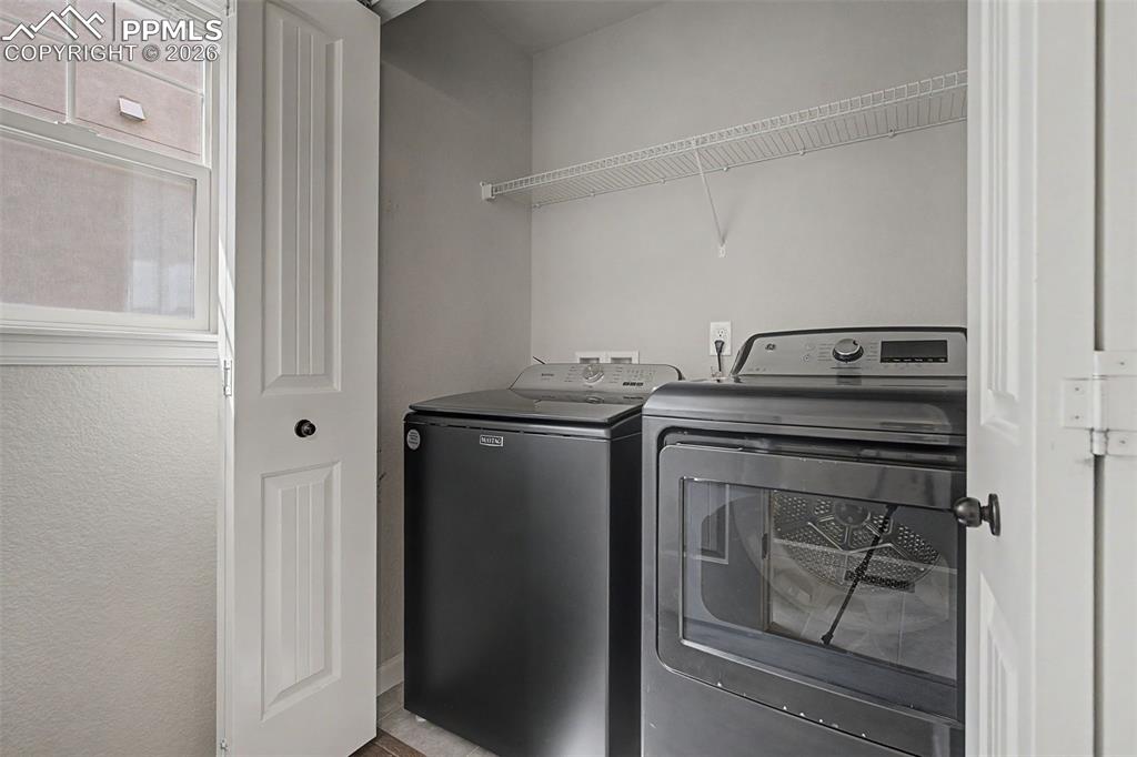 4467 Hessite Loop Colorado Springs, CO 80938 - Photo 16 of 37 a utility room with dryer and washer