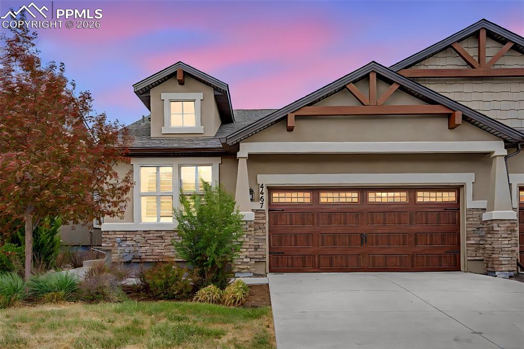4467 Hessite Loop Colorado Springs, CO 80938 - Photo 2 of 37 a front view of a house with a garage