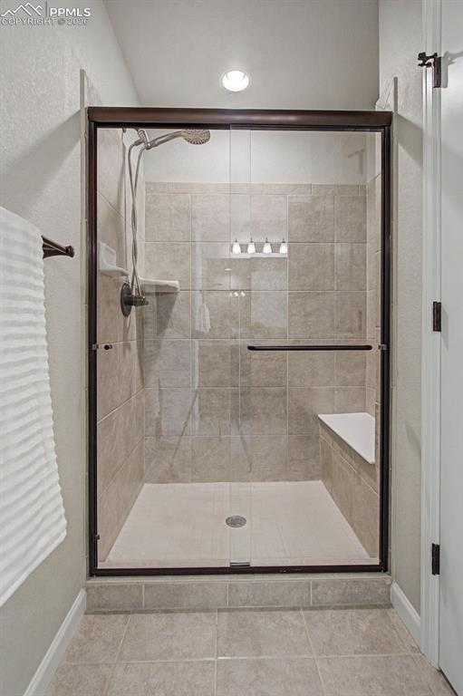 4467 Hessite Loop Colorado Springs, CO 80938 - Photo 22 of 37 a bathroom with a shower