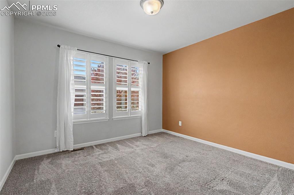 4467 Hessite Loop Colorado Springs, CO 80938 - Photo 24 of 37 an empty room with windows