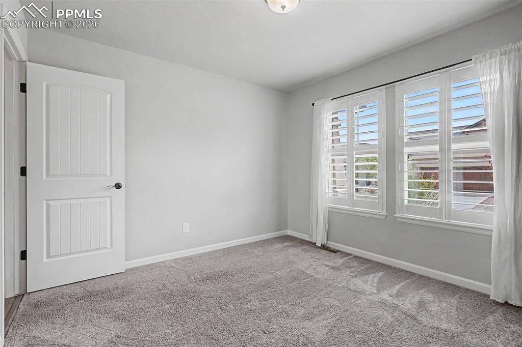 4467 Hessite Loop Colorado Springs, CO 80938 - Photo 25 of 37 a view of an empty room with a window