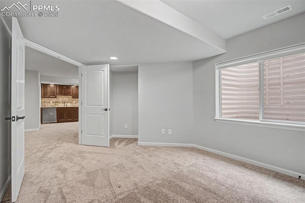 4467 Hessite Loop Colorado Springs, CO 80938 - Photo 30 of 37 a view of an empty room with a window