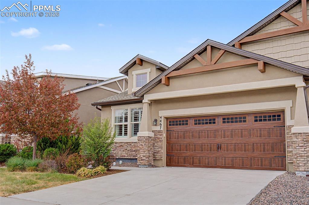 4467 Hessite Loop Colorado Springs, CO 80938 - Photo 3 of 37 a front view of a house with a garage