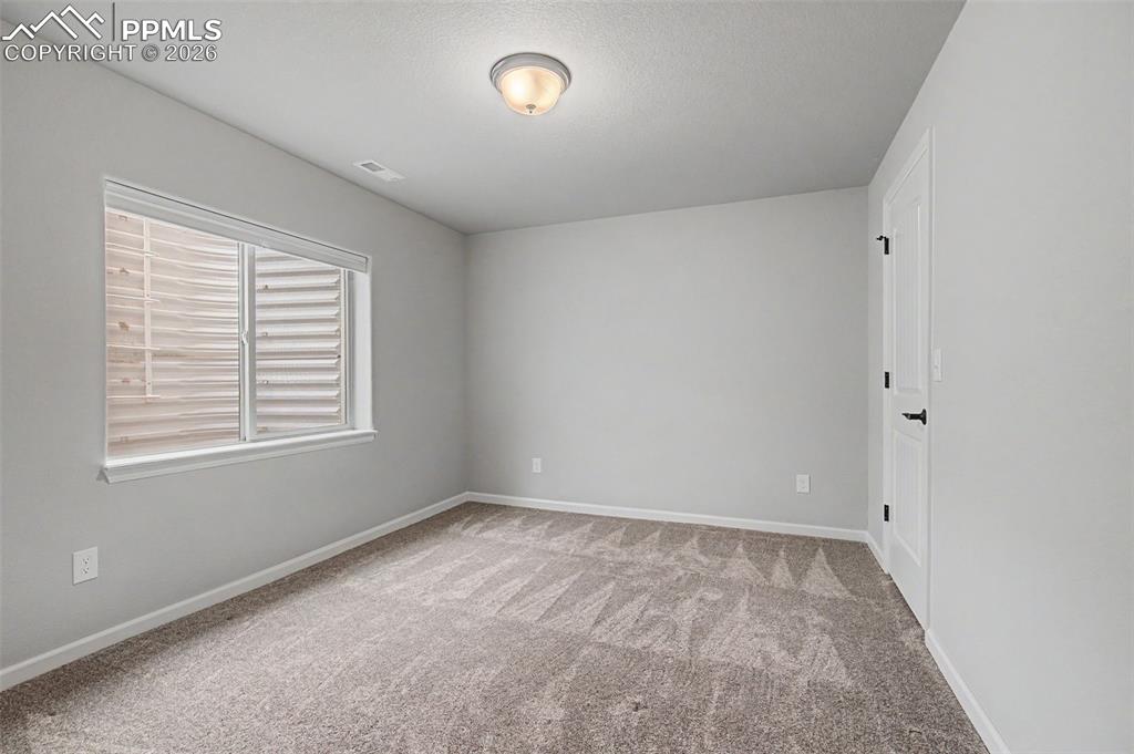 4467 Hessite Loop Colorado Springs, CO 80938 - Photo 33 of 37 an empty room with a window