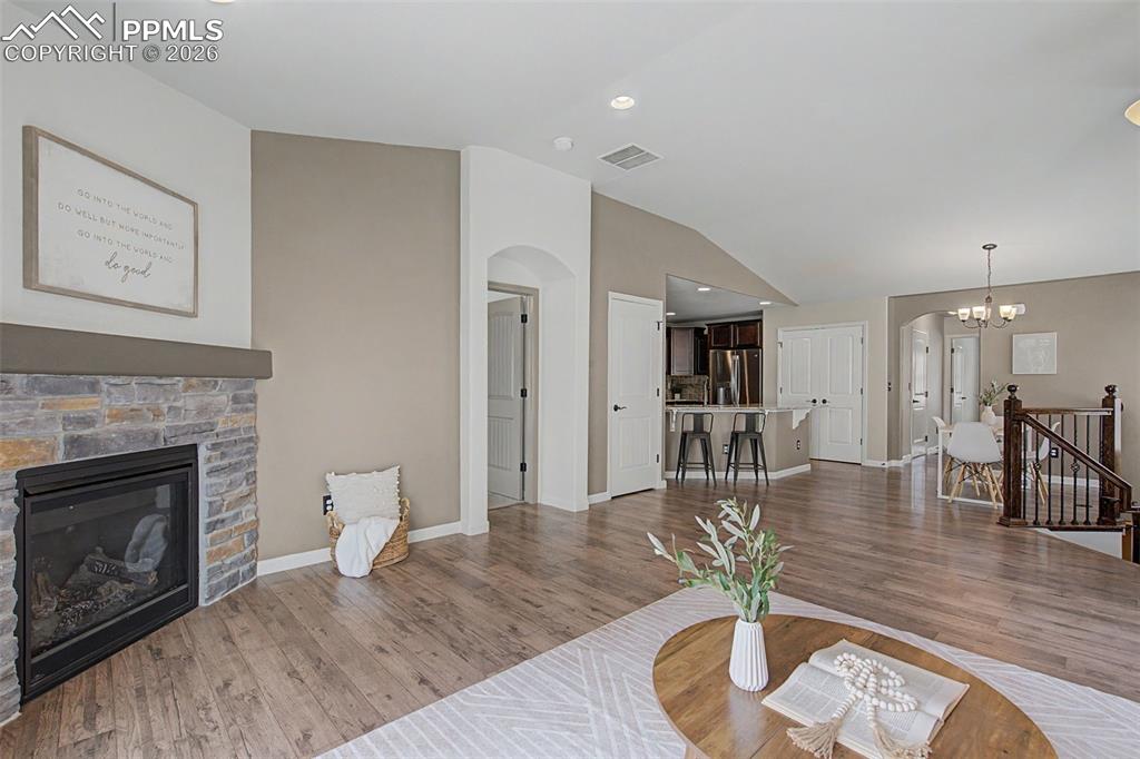 4467 Hessite Loop Colorado Springs, CO 80938 - Photo 7 of 37 a living room with furniture and a fireplace