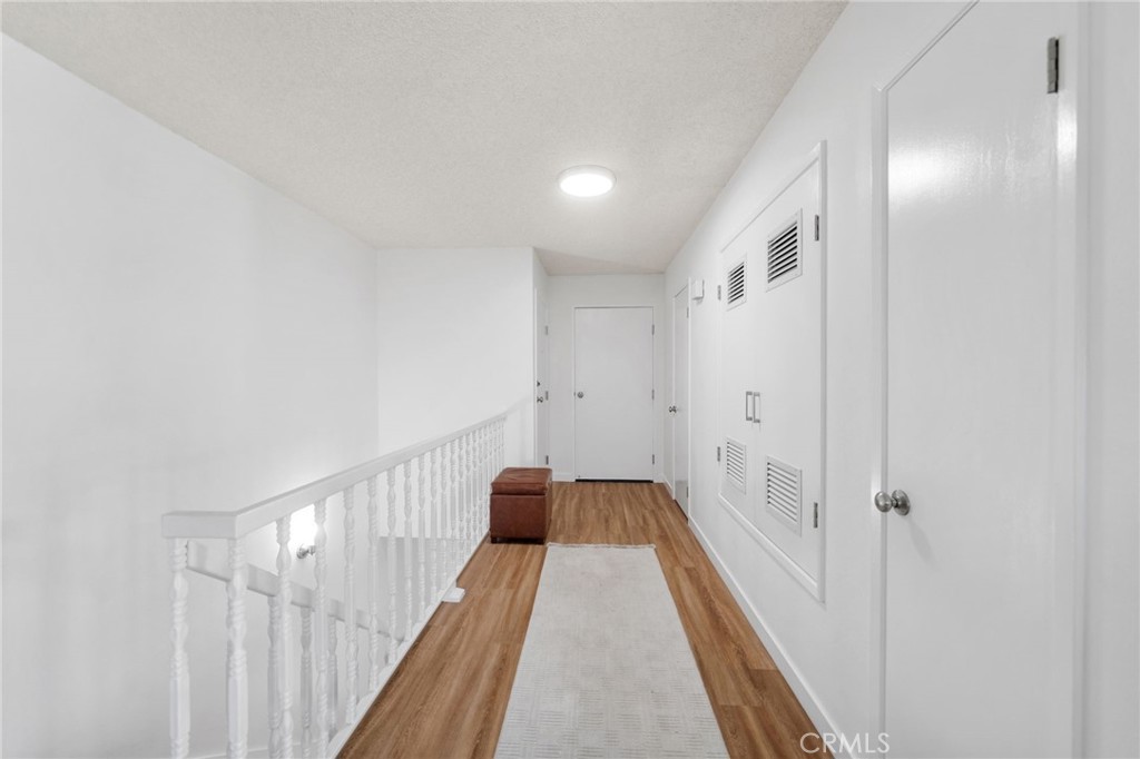 4219 La Pinata Way, Unit 252 Oceanside, CA 92057 - Photo 7 of 37 Hallway leading to front door and garage access.