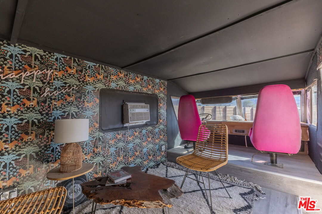 4789 Avenida Del Sol Joshua Tree, CA 92252 - Photo 23 of 37 a living room with furniture