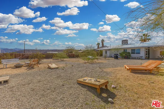a view of a patio with swimming pool