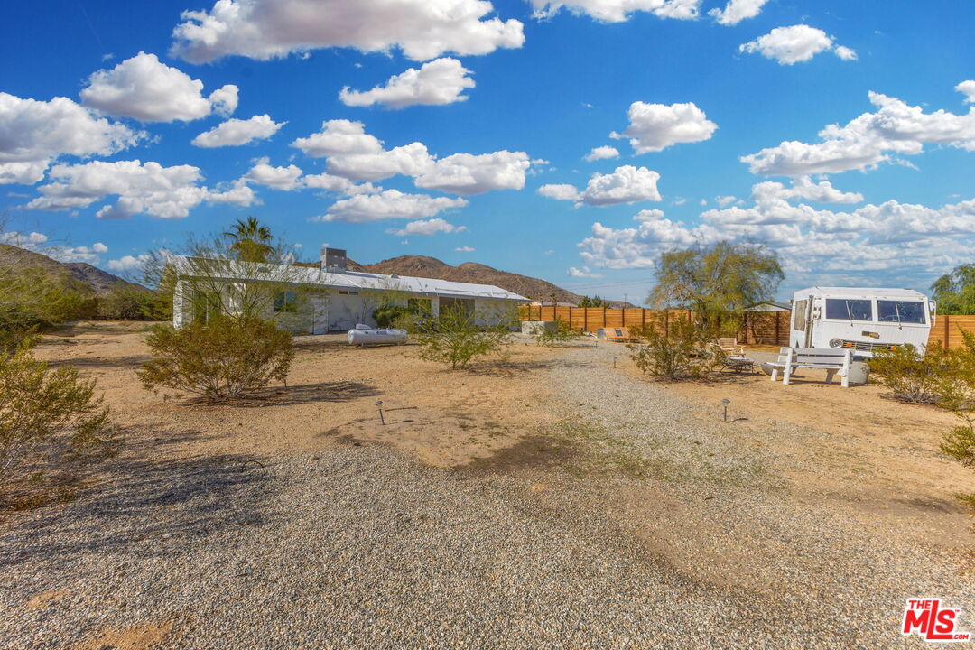4789 Avenida Del Sol Joshua Tree, CA 92252 - Photo 26 of 37 a view of a lake with houses