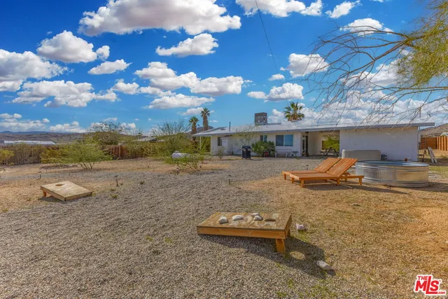 a view of a room with a table and chairs