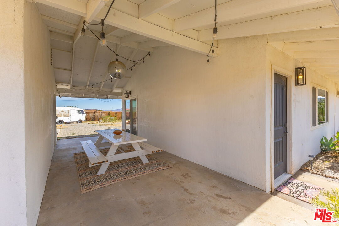 4789 Avenida Del Sol Joshua Tree, CA 92252 - Photo 33 of 37 a view of a room with a table and chairs