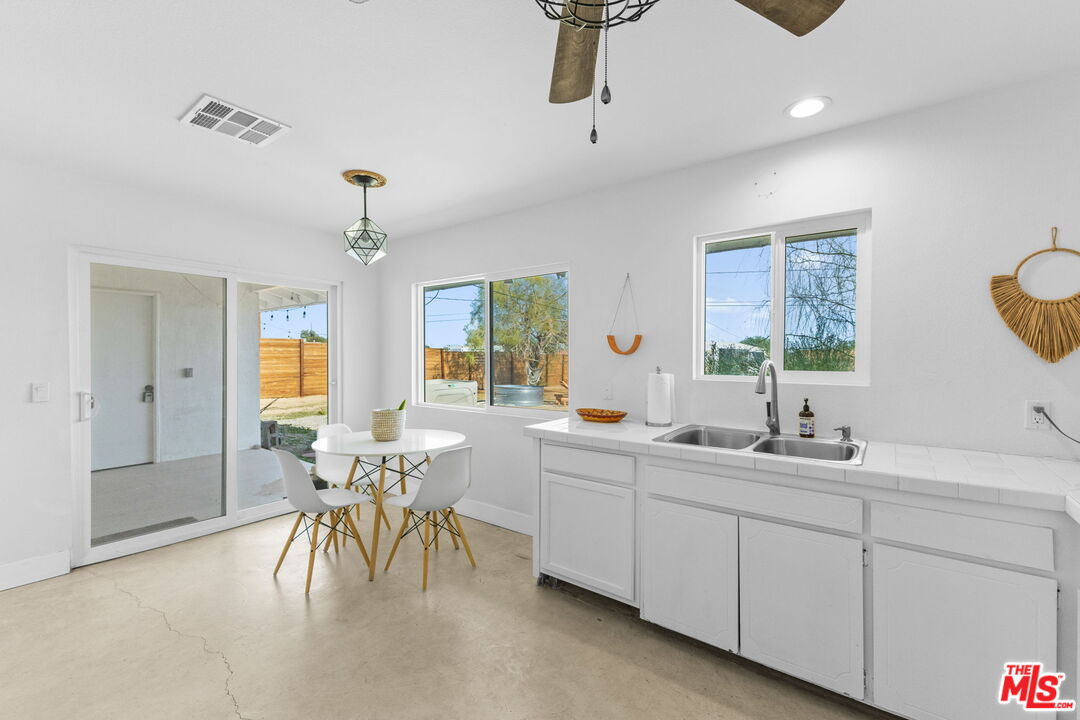 4789 Avenida Del Sol Joshua Tree, CA 92252 - Photo 10 of 37 a kitchen with sink and window