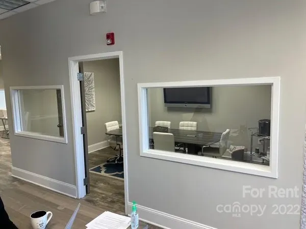 a kitchen with a sink and a mirror