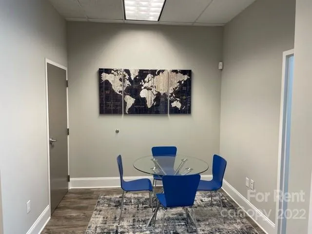 a view of dining room with furniture and wooden floor