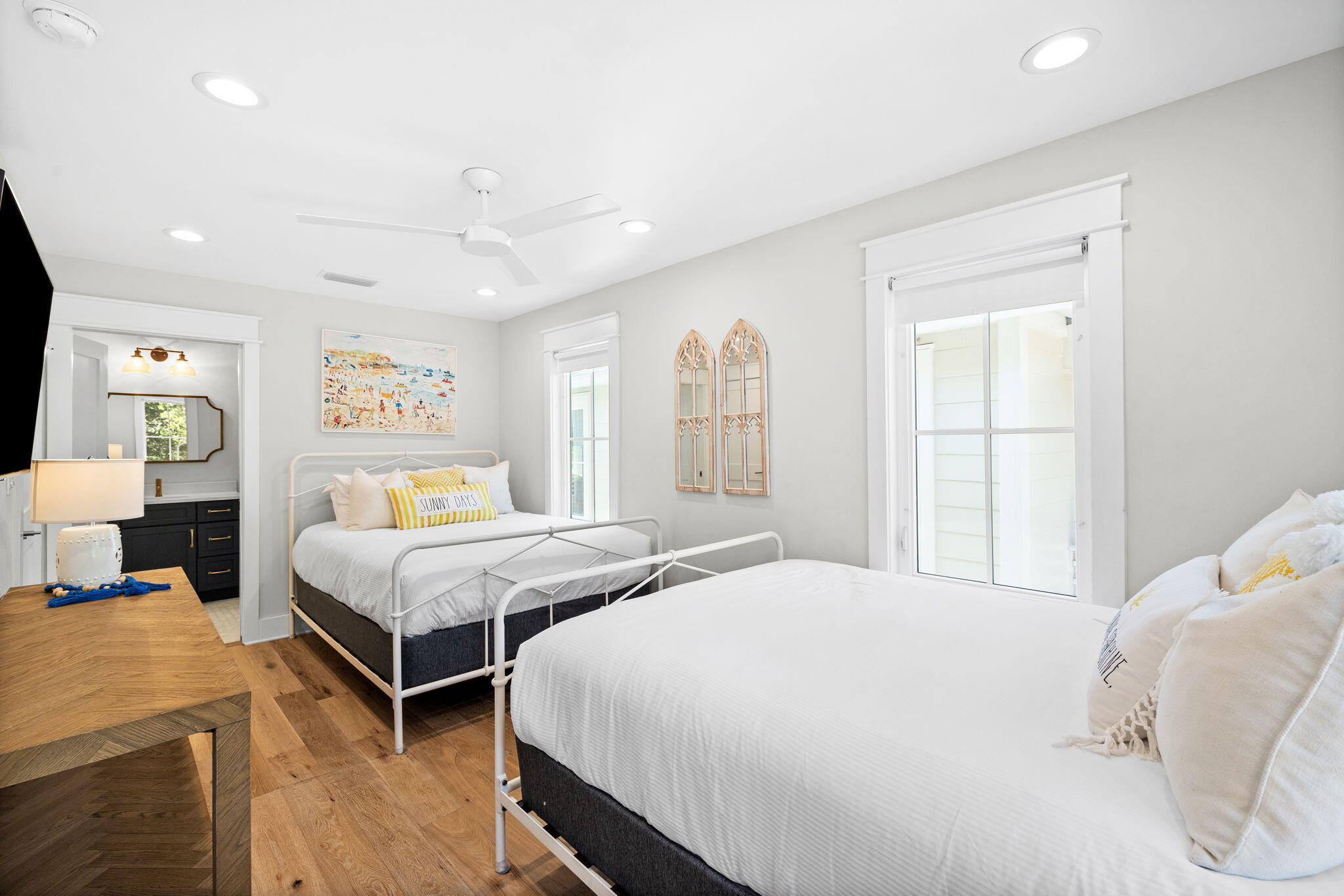 6312 West County Highway 30A Santa Rosa Beach, FL 32459 - Photo 19 of 58 a bedroom with a bed and wooden floor