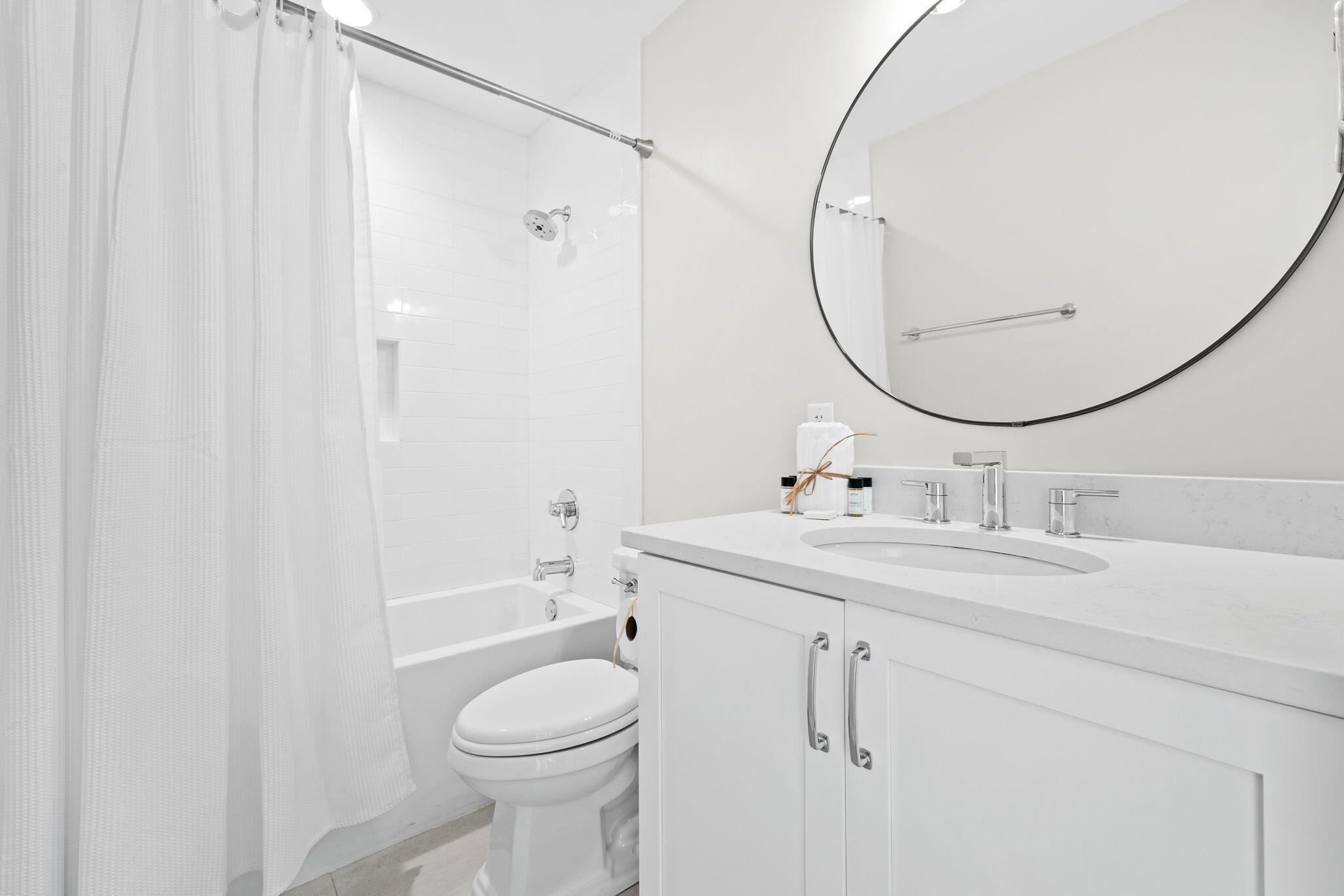 6312 West County Highway 30A Santa Rosa Beach, FL 32459 - Photo 52 of 58 a bathroom with a sink toilet and shower