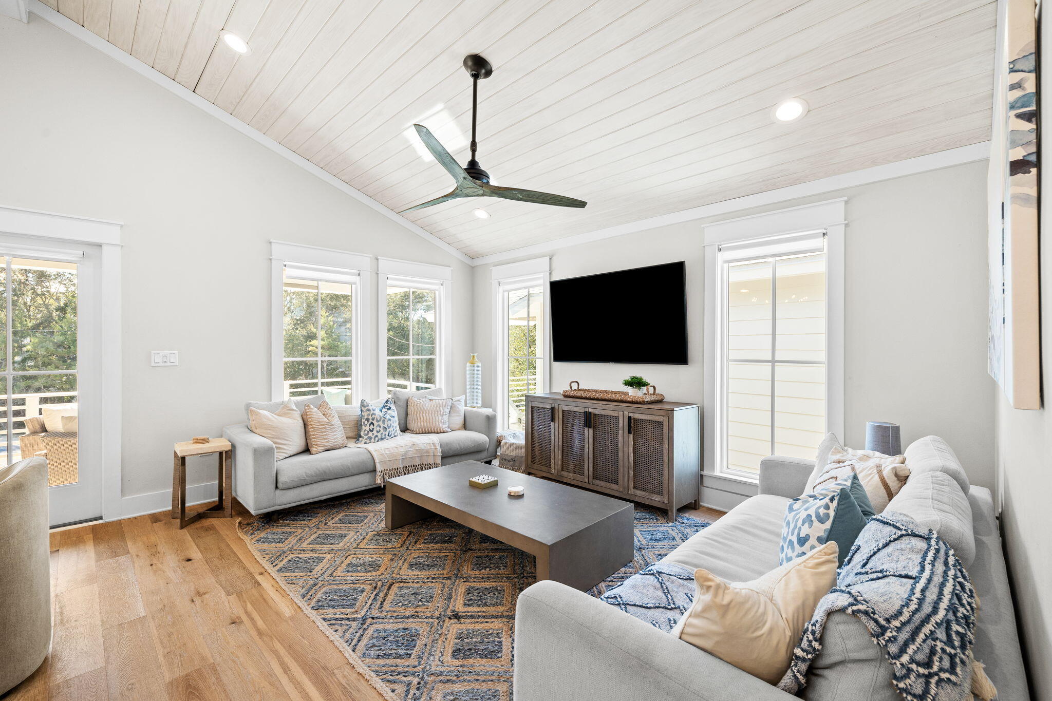 6312 West County Highway 30A Santa Rosa Beach, FL 32459 - Photo 6 of 58 a living room with furniture and a flat screen tv