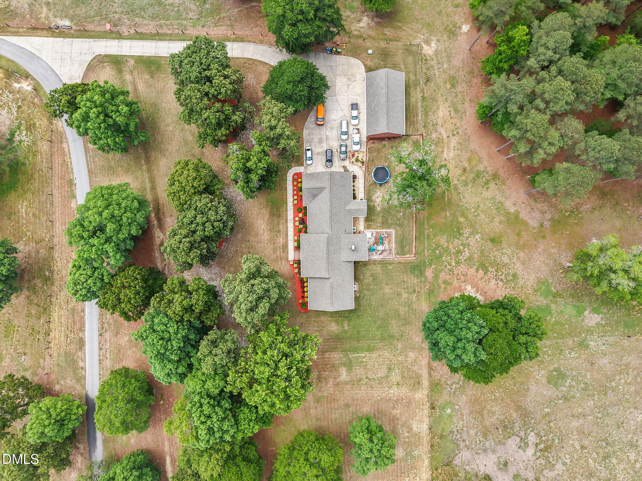 2880 Elevation Road Four Oaks, NC 27524 - Photo 3 of 51 an aerial view of a house with a yard and garden