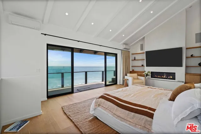 an aerial view of a house with a ocean view