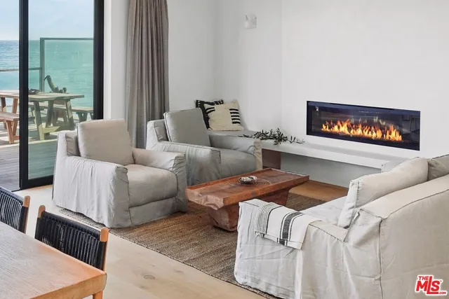 a bedroom with a large bed and a large window