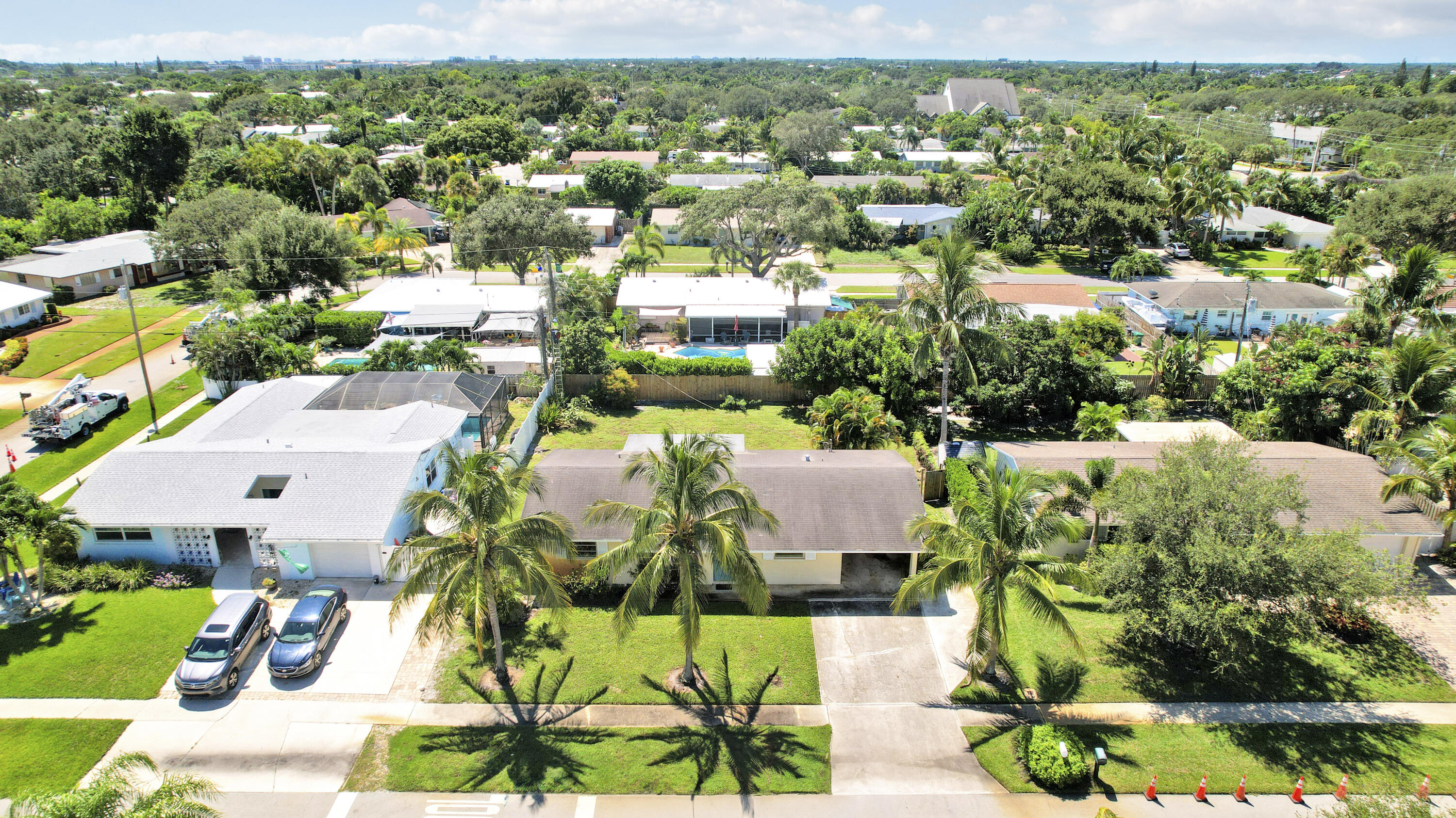 20 Willow Road Tequesta, FL 33469 - Photo 1 of 43 a picture of a city with lots of plants and lake view
