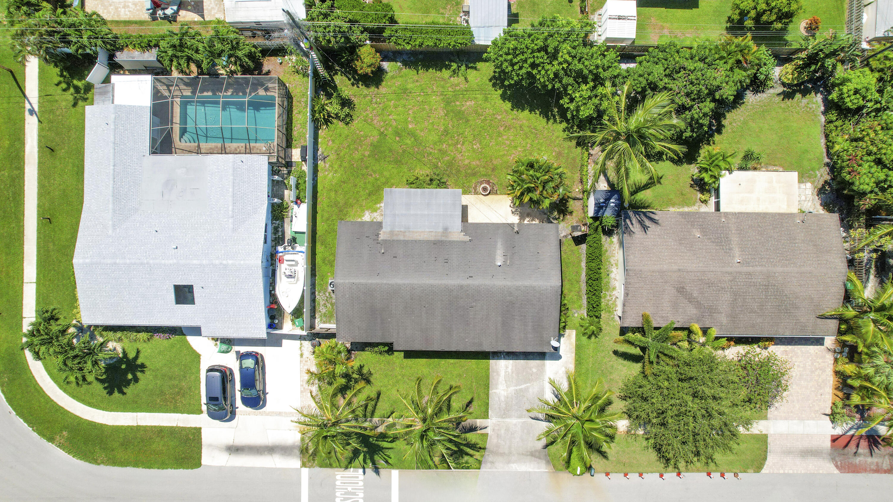 20 Willow Road Tequesta, FL 33469 - Photo 12 of 43 an aerial view of a house with a garden and yard