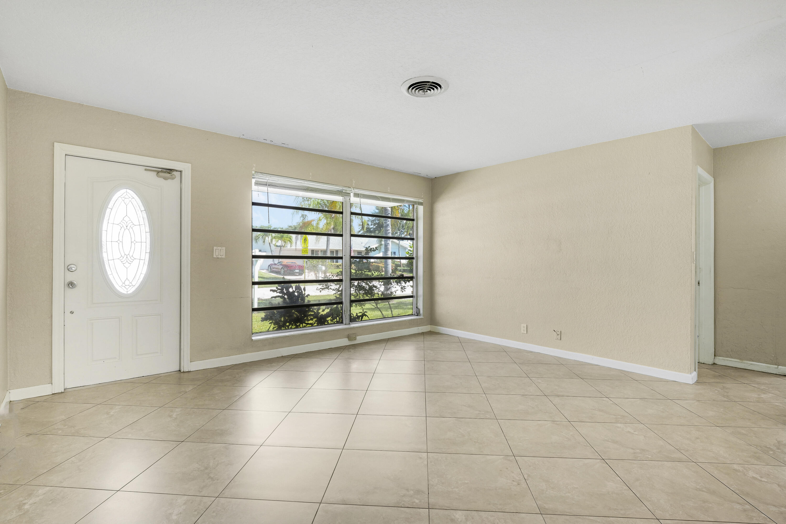 20 Willow Road Tequesta, FL 33469 - Photo 17 of 43 a view of an empty room with a window