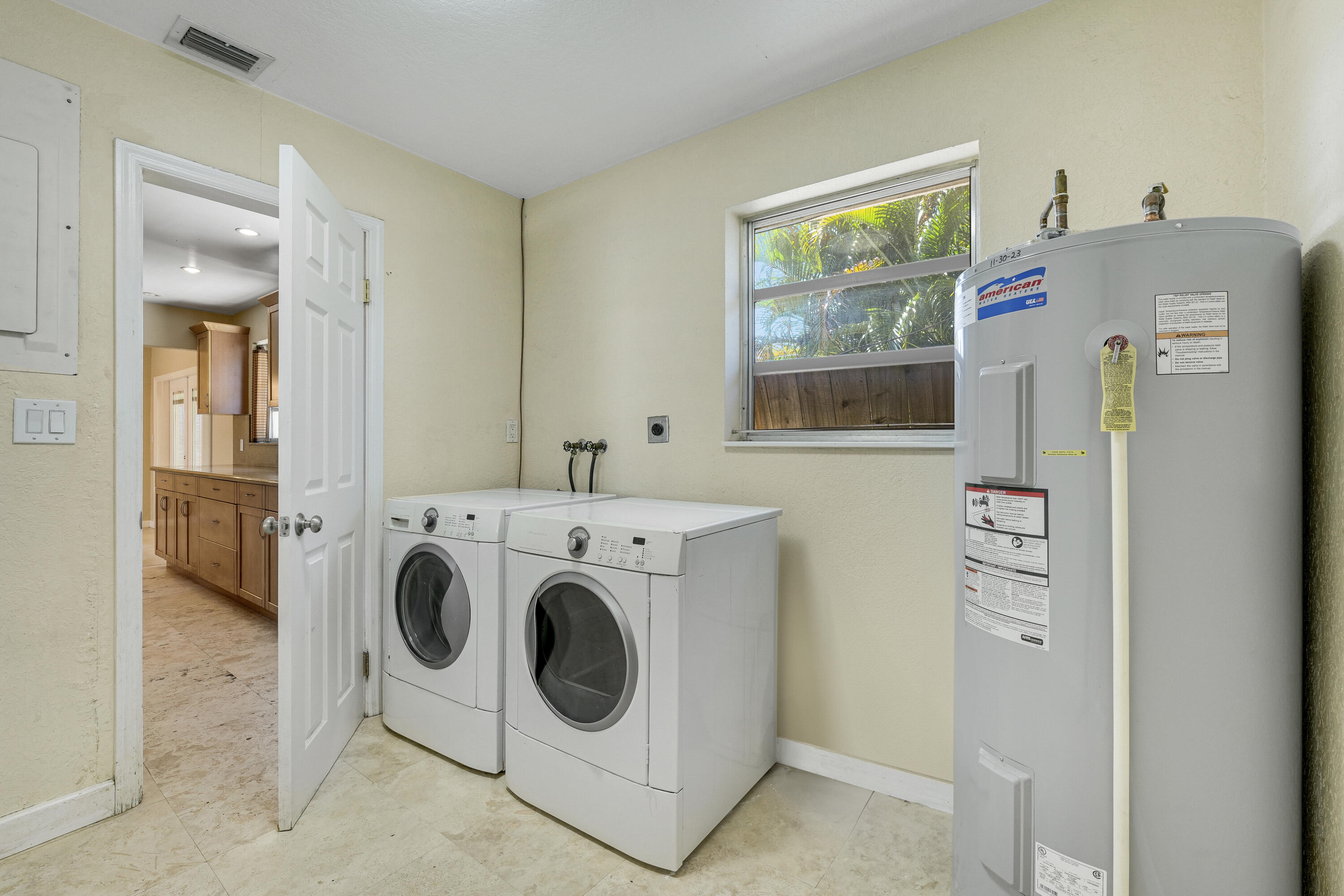 20 Willow Road Tequesta, FL 33469 - Photo 23 of 43 a utility room with dryer and washer