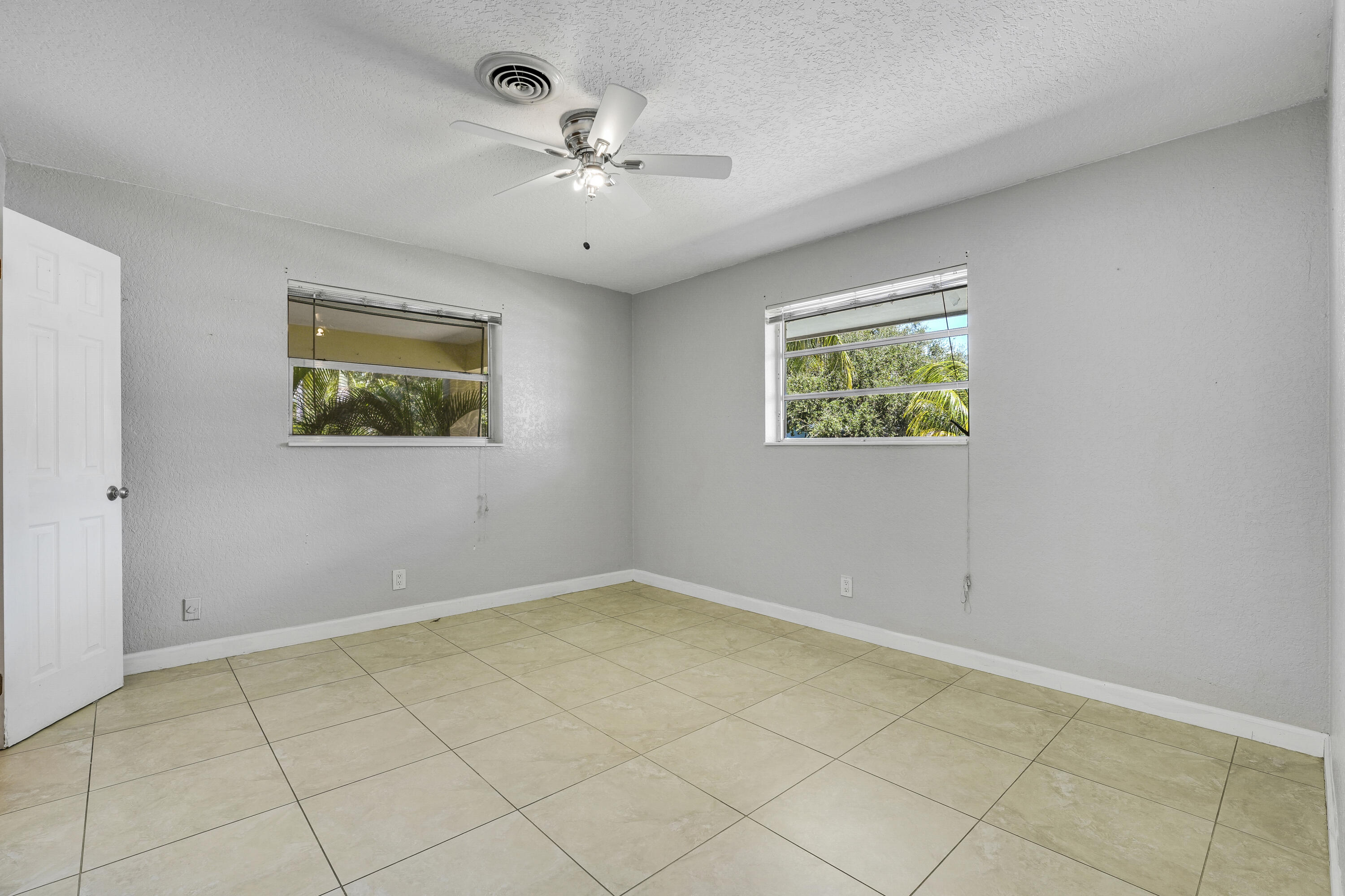 20 Willow Road Tequesta, FL 33469 - Photo 24 of 43 a view of an empty room with a window